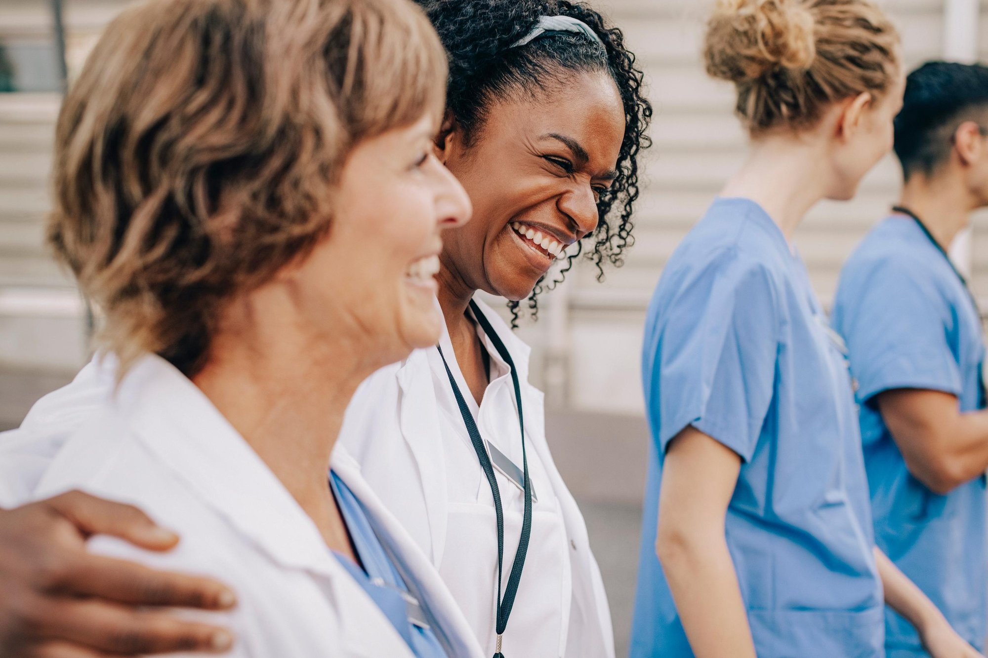 JJ_Photo_Hospital staff laughing and walking together_GettyImages_1461608440_4Star