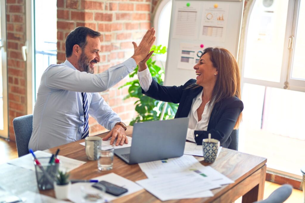 two people high-fiving